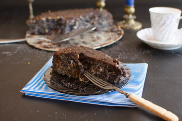 Poppy seed cake with nuts and raisins topped with dark chocolate..