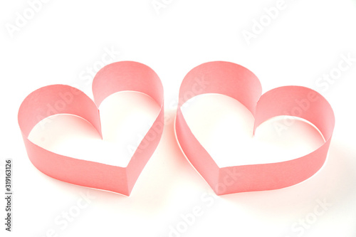 Couple of pink paper hearts on white background isolated. Cute love, valentines day, womens day banner, offer, card, invitation, flyer, poster template.