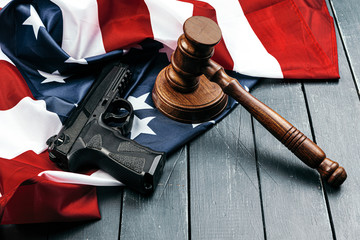 Wall Mural - Judge gavel on the background of the flag united states of America