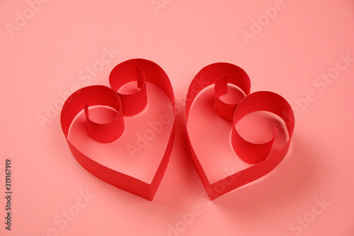 Couple of red paper hearts on pink background. Good love, valentines day, womens day banner, offer, card, invitation, flyer, poster template.