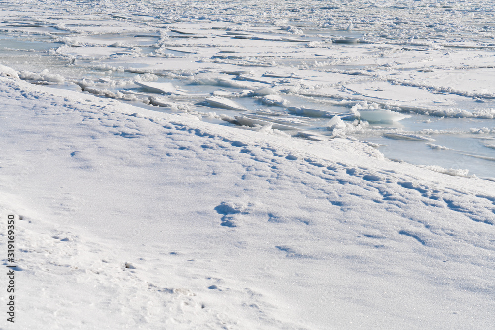White snow surface texture with soft shadow.
