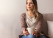 © Prostock-studio - Peaceful girl enjoying hot coffee at home, selective focus