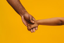 Cropped Of African Father And Daughter Holding Hands