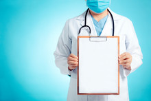 Doctor Showing Blank Clipboard For  Personal Message Or Advice
