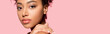 Leinwandbild Motiv panoramic shot of beautiful african american girl with clean face, isolated on pink