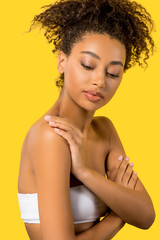 Wall Mural - portrait of beautiful african american girl with clean face, isolated on yellow
