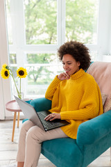 Wall Mural - Woman having video call on laptop computer