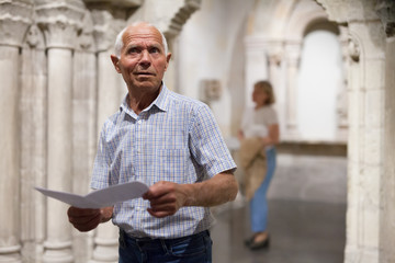 Wall Mural - Male retiree visiting exposition of museum