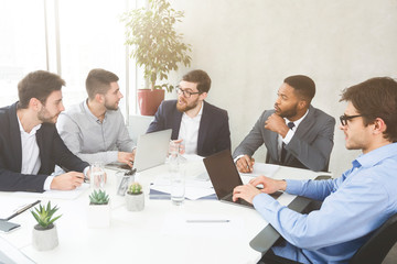 Poster - Businessmen having group meeting, discussing new project