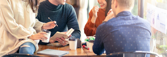 Group of Asian business people and creative designer meeting in caFE casual talk together with happiness and joyful