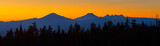 Fototapeta Las - Colorful panoramic view after sunset with Mt Bachelor and Sisters Mountains near Bend in central Oregon.