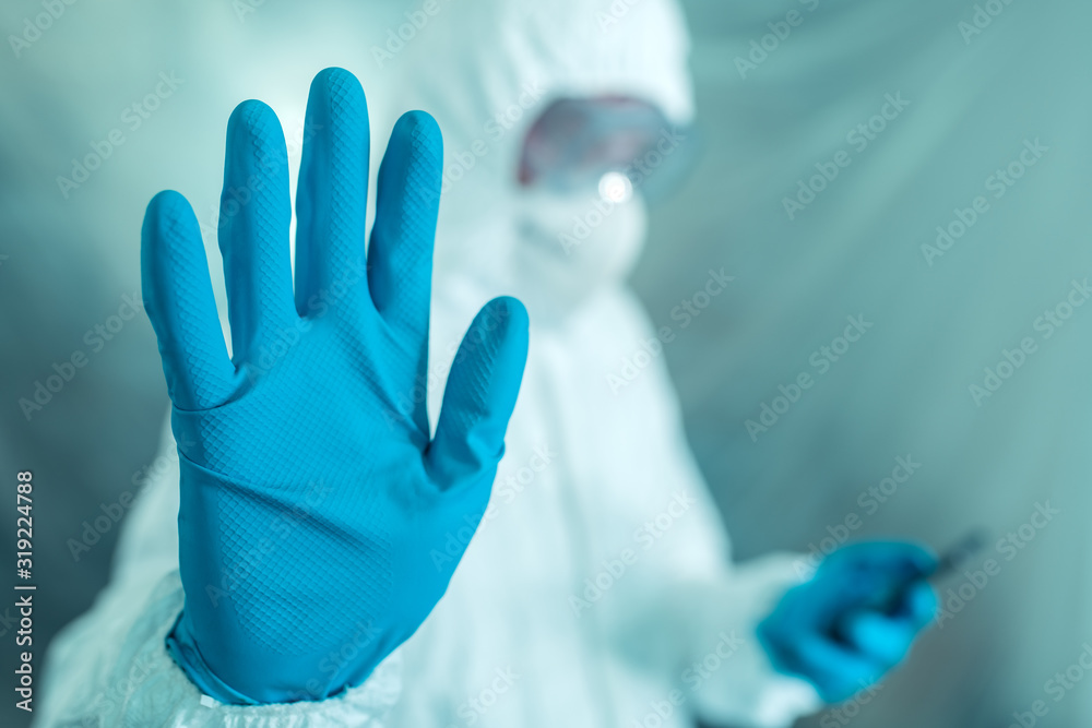 Epidemiologist gesturing stop hand sign in coronavirus concept - obrazy, fototapety, plakaty 