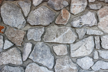 Poster - Stacked rough cut stone wall texture background