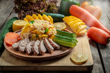 Wall Mural - Pineapple fried rice In a wooden dish ,Thailand food, cooking