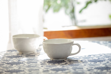 Coffee in the morning, Two white cup of espresso on the table in home.