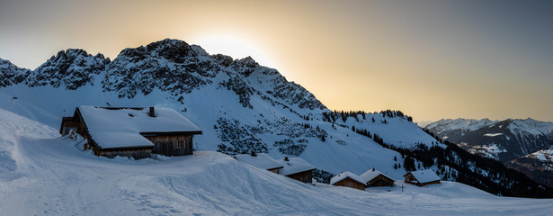 Evening mood in a lonely mountain hut in the Austrian Alps, summit of the Breithorn in the background, Grosses Walsertal