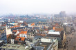 The skyline and buildings architecture in Ghent Belgium on a cloudy foggy winter European day