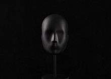 Black Mannequin Head Isolated On Black Background