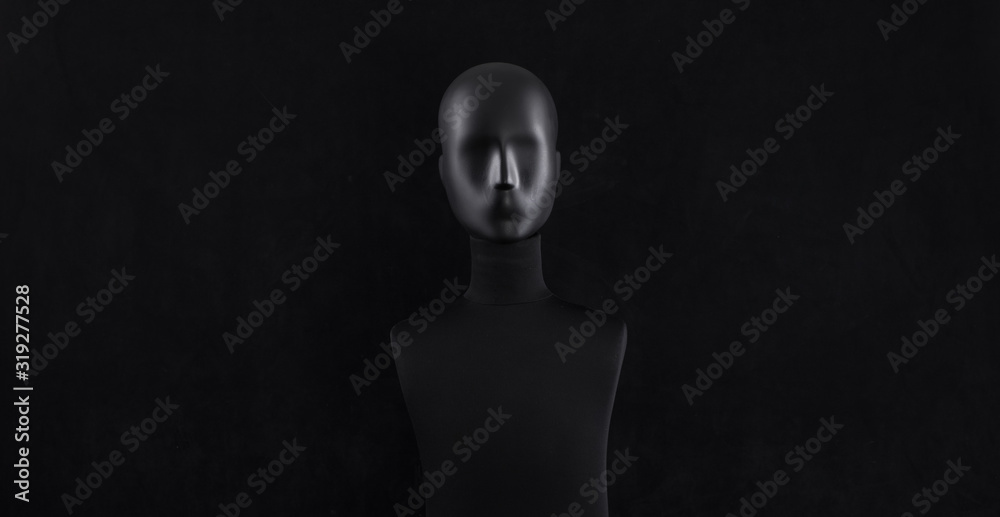 black mannequin head isolated on black background - obrazy, fototapety, plakaty 