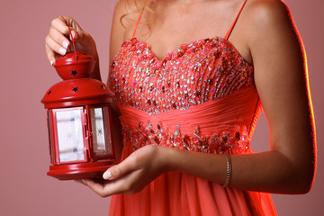 woman hands hold red decorative lantern