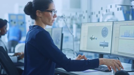 Poster - Diverse Team of Industrial Engineers Working in Glass Office, using PC, Doing 3D Modelling in CAD Software. Outside Office Modern Factory Workshop with Professionals Working on CNC Machinery