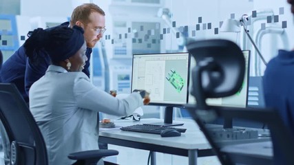 Poster - Modern Electronics Factory: Male Supervisor Talks to a Female Electrical Engineer who Works on Computer with CAD Software. Designing PCB, Microchips, Semiconductors and Telecommunications Equipment