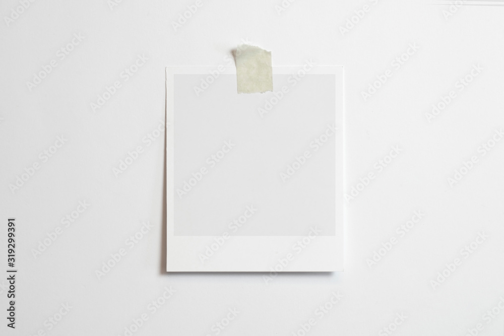 Blank polaroid photo frame with soft shadows and scotch tape isolated on white paper background as template for graphic designers presentations, portfolios etc. - obrazy, fototapety, plakaty 