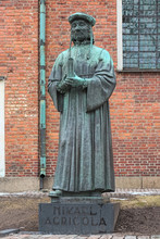 Turku, Finland. Statue Of The Protestant Reformer Mikael Agricola In Front Of Turku Cathedral.