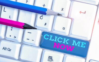 Poster - Conceptual hand writing showing Click Me Now. Concept meaning Internet helping desk Press the button Online Icon Nertwork White pc keyboard with note paper above the white background