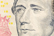 Macro close up photograph of Alexander Hamilton on the US ten dollar bill.
