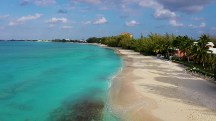 Wall Mural - aerial drone footage of seven mile beach, west bay and george town on the island of grand cayman in the cayman islands in the clear blue and green tropical waters of the caribbean sea