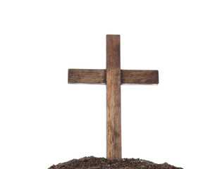 Wooden cemetery cross and soil on white background