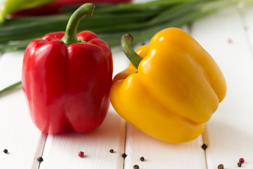 two bell peppers on a white background