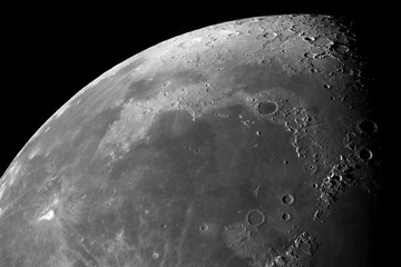 Photo of the moon with high magnification. Moon, view through a telescope. Moon with craters.