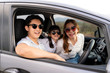 © Prasit Rodphan - Happy Asian family with father, mother and daughter wear sunglass in compact car are smiling and driving for travel on vacation. Car insurance or rental and family happy to journey concept..