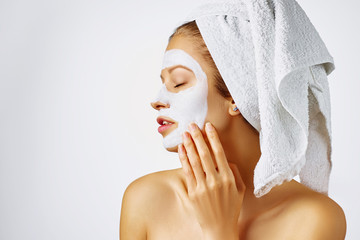 Wall Mural - cosmetology, skin care, face treatment, spa and natural beauty concept. woman with facial mask.