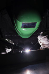 Wall Mural - Welder using the tig welding method.