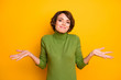 I don't know. Photo of beautiful lady spread hands shrug shoulders careless ignorance expression said bad wrong thing wear casual green turtleneck isolated yellow color background