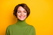 © deagreez - Closeup photo of short hairdo pretty lady charming smiling good mood looking side empty space sly eyes wear casual green warm turtleneck isolated yellow color background