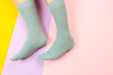 legs in colorful socks on colorful  background - Image