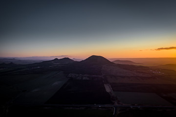 Wall Mural - Rana is a significant three-peak mountain 457m. in the western part of Ceske stredohori. The Rana National Nature Reserve is situated on the south-western hill of the trike, is the center of paraglide