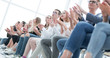 © ASDF - background image of young people applauding in the conference room