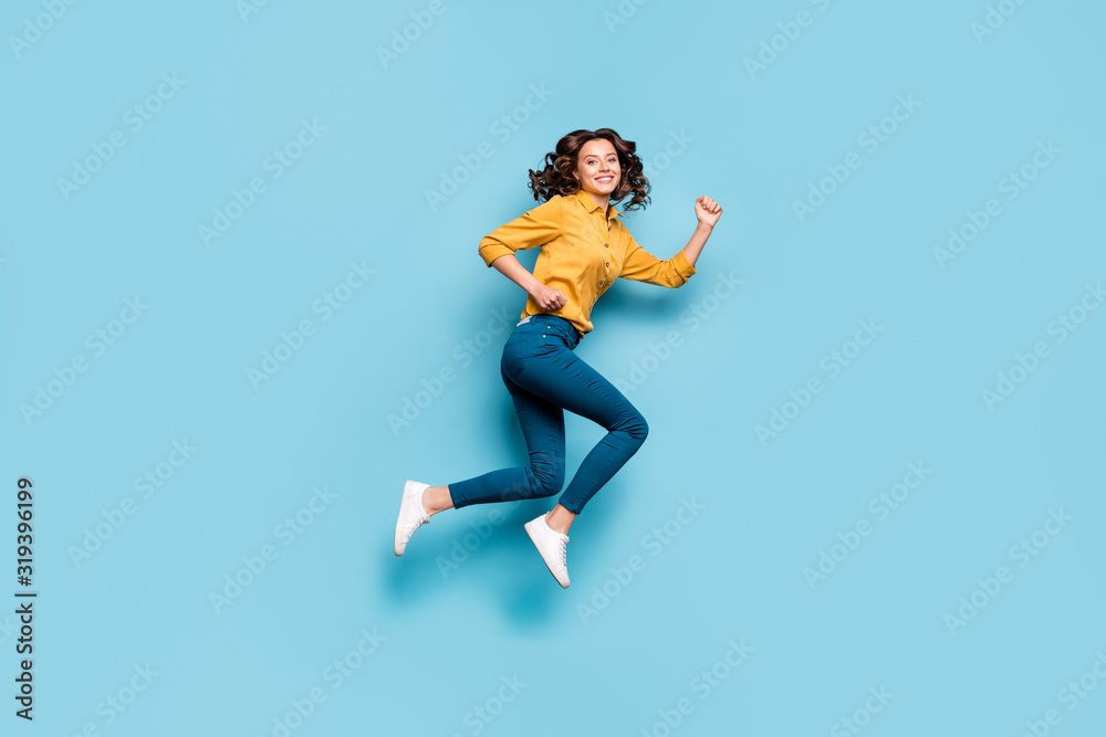 Full length body size profile side view of nice sportive cheerful wavy-haired girl jumping running fast life inspiration isolated on bright vivid shine vibrant green blue turquoise color background - obrazy, fototapety, plakaty 
