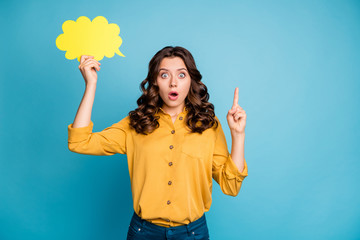 Poster - Portrait of her she nice attractive astonished wavy-haired girl holding in hands yellow copy space card pointing up isolated over bight vivid shine vibrant green blue turquoise color background