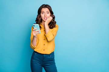 Wall Mural - photo of pretty lady holding telephone hands biting fingers eyes full of fear negative post comments