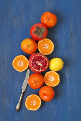 Wall Mural - Mixed fruits on blue wood