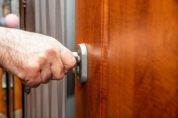 Poster - Locking the door. The concept of taking care of home security, locking the door to protect yourself against burglary.