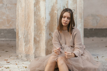 teen girl in brown tulle skirt and autumn sweater