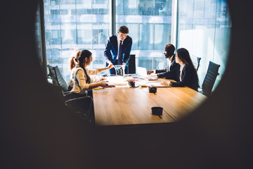 Wall Mural - Employees working together in meeting room