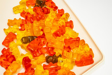 Teddy Bear Figured And Colorful Jelly Beans In Plate On White Background.